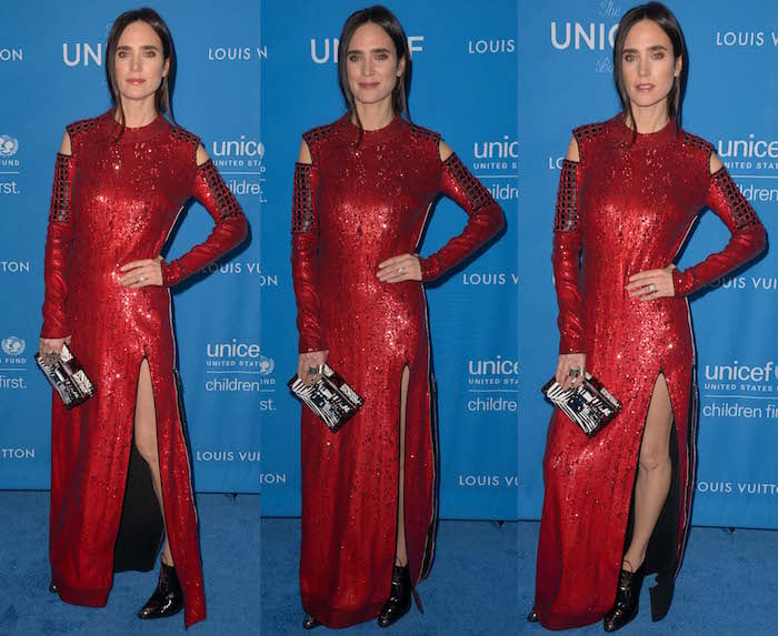 Jennifer Connelly wears a full Louis Vuitton ensemble, including a dress, boots, rings and clutch