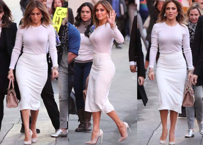 Blending style and grace: Jennifer Lopez pairs a long-sleeved white top with a Roland Mouret pencil skirt for her appearance on Jimmy Kimmel Live!