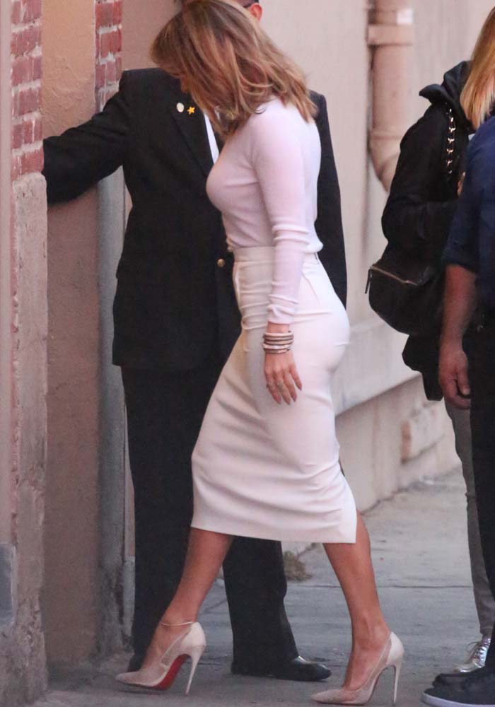 Jennifer Lopez matches her pale pink ensemble with Christian Louboutin pumps
