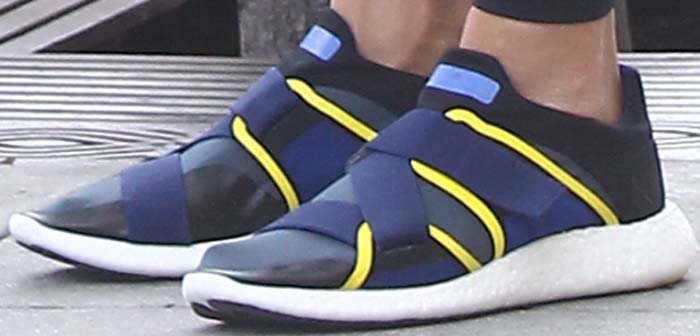 Jessica Alba's feet in blue-and-yellow Adidas x Stella McCartney glove sneakers