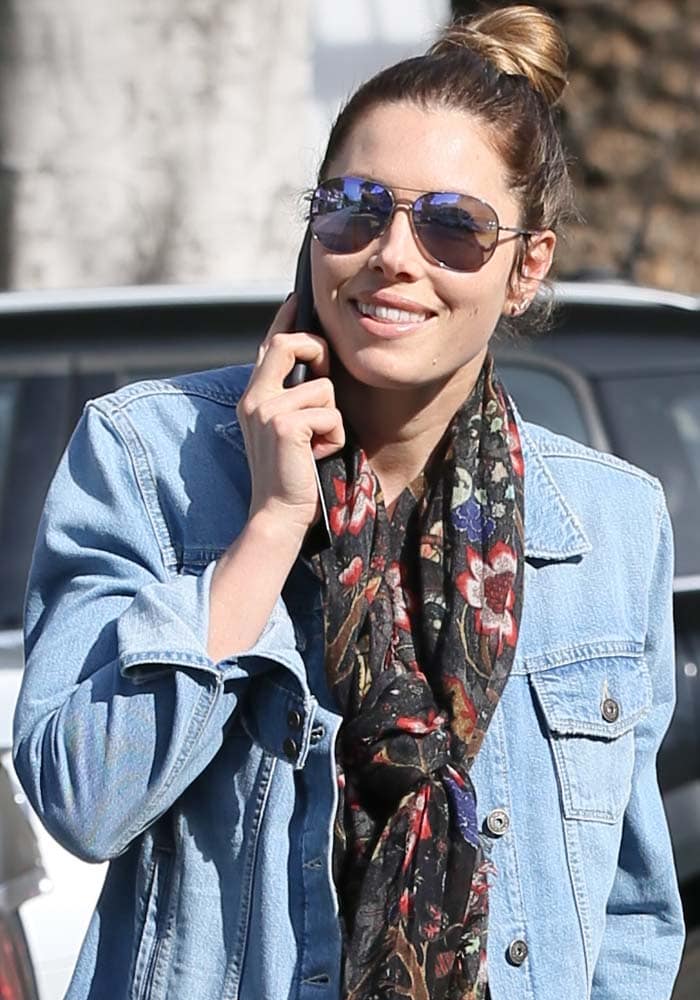 Jessica Biel wears a floral scarf and sunglasses from Victoria Beckham