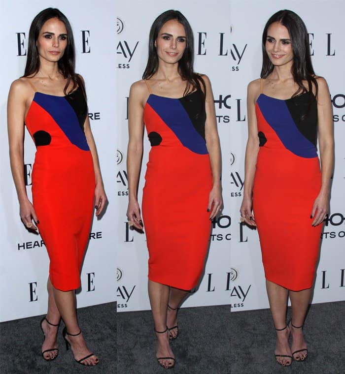 Jordana Brewster in a red-orange fitted dress from Victoria Beckham featuring a black and cobalt blue color-block panel with leather straps and a zipper back at the ELLE’s Women In Television Celebration