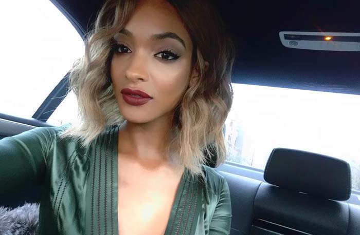 Jourdan Dunn wears a green Burberry dress in a car