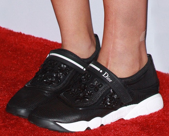 Kaley Cuoco's feet in black Dior sneakers