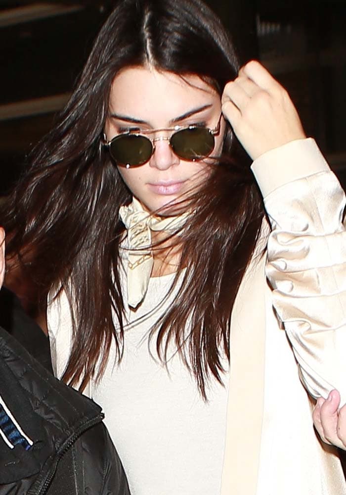 Kendall Jenner wears her hair down as she arrives at Los Angeles International Airport
