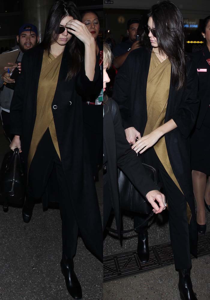 Kendall Jenner clutches a Givenchy bag as she strolls through LAX