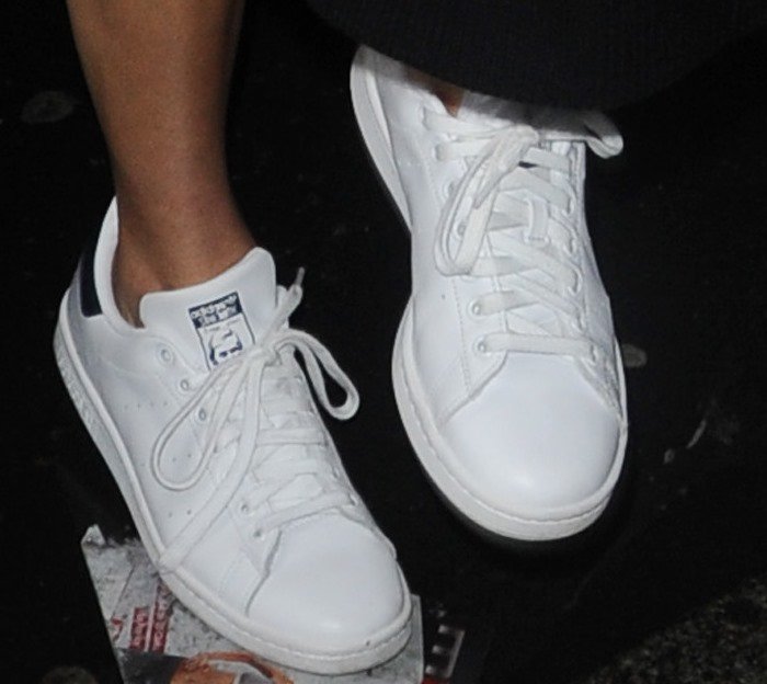 Kendall Jenner's feet in white Adidas sneakers