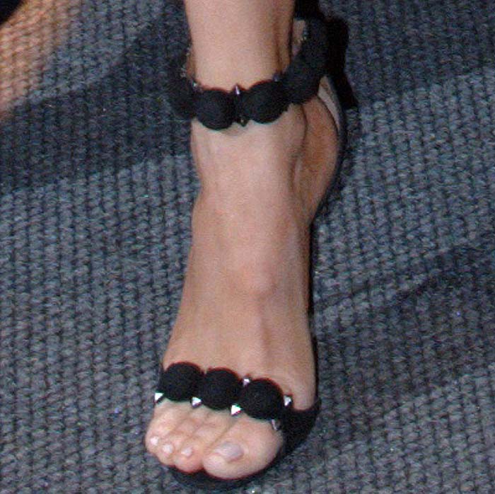 Khloe Kardashian's feet in black embellished Alaïa sandals
