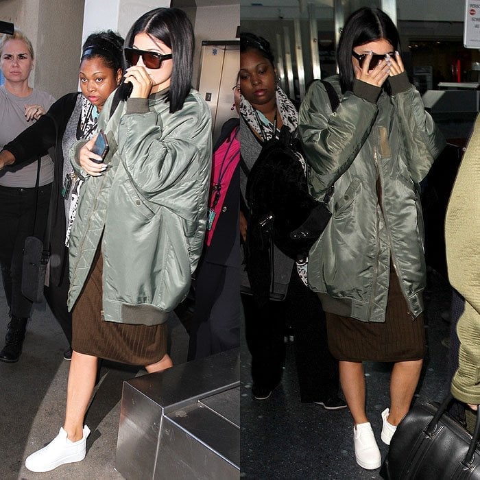 Kylie Jenner white sneakers bomber jacket