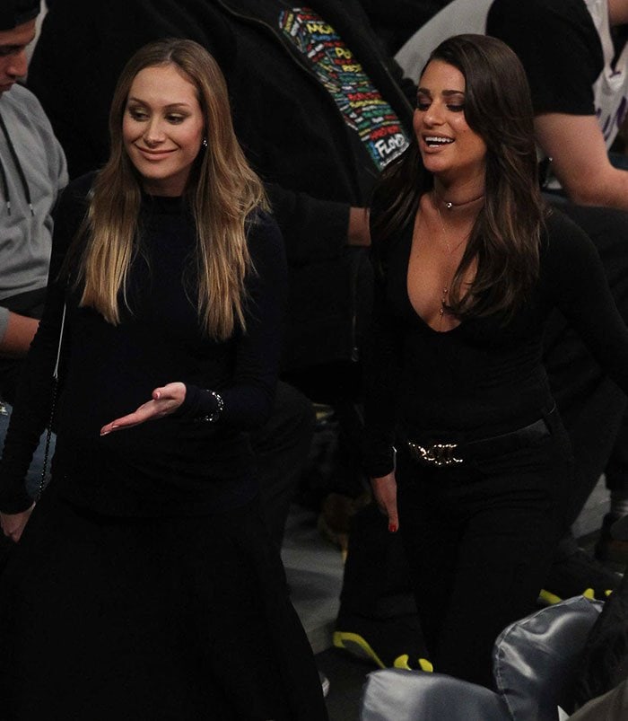 Lea Michele in a plunging black top and a pair of jeans at the Golden State Warriors and Los Angeles Lakers basketball game