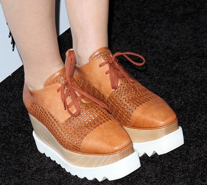Lily Collins wears a pair of Stella McCartney platform oxfords