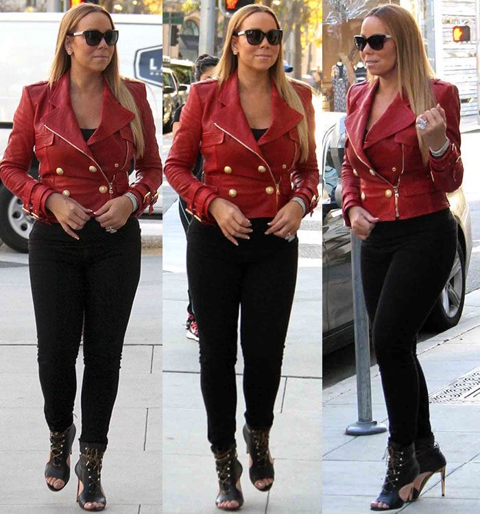 Mariah Carey highlighted her curves by teaming her red leather jacket with fitted black jeans