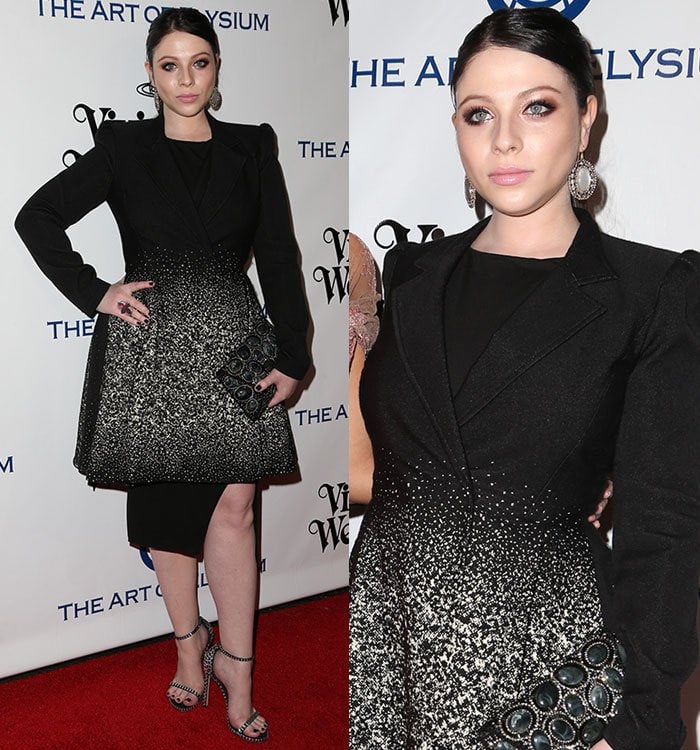 Michelle Trachtenberg, standing 5ft 6in tall, elevated her Gothic-glam look in a black Alice + Olivia coat dress and crystal-embellished Stuart Weitzman heels that added extra height on the red carpet