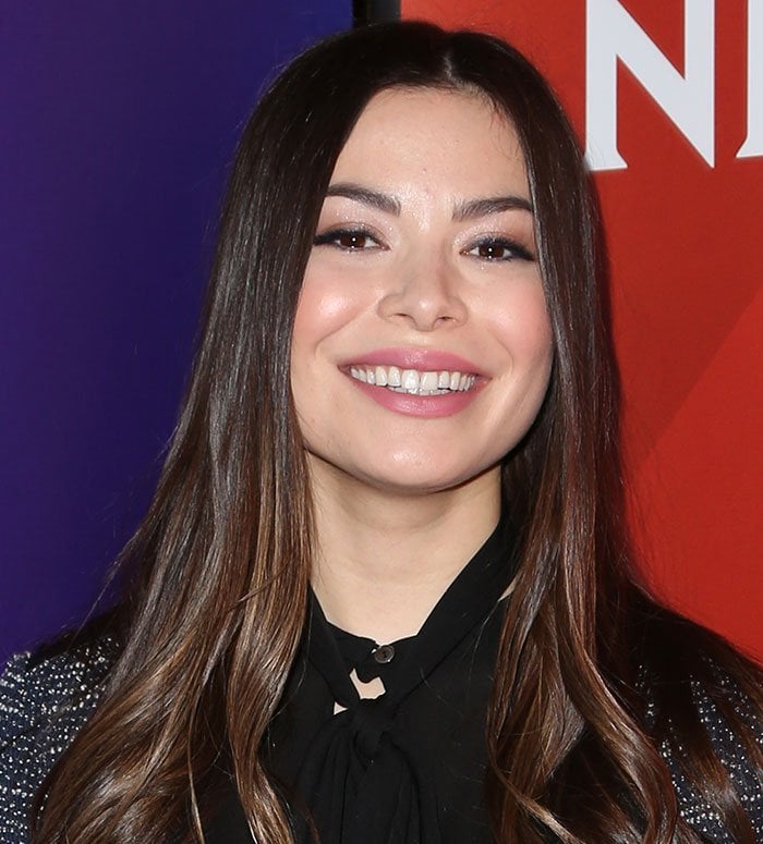 Miranda Cosgrove wore her hair down with a middle parting