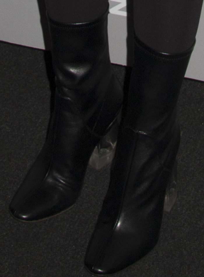 Natalie Portman wears a pair of black boots from Christian Dior