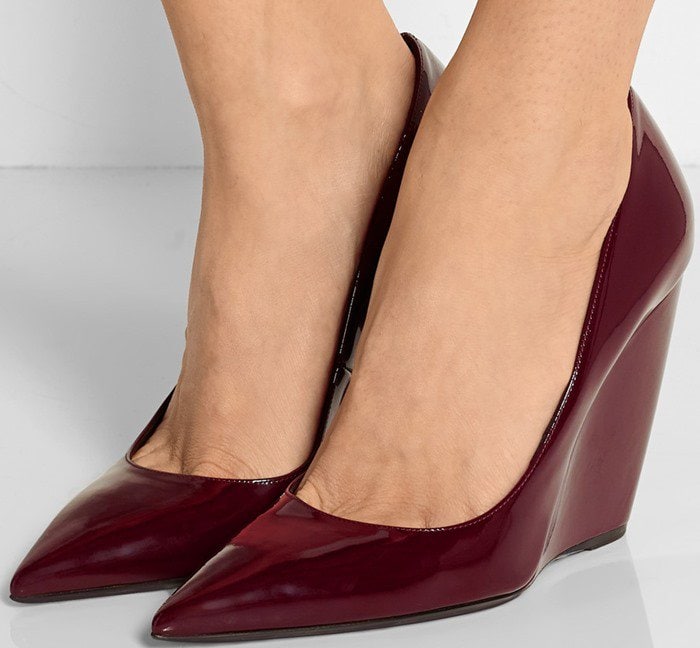 Nicholas Kirkwood's burgundy patent-leather 'Lizy' pumps have been faultlessly handcrafted in Italy with a stable wedge heel