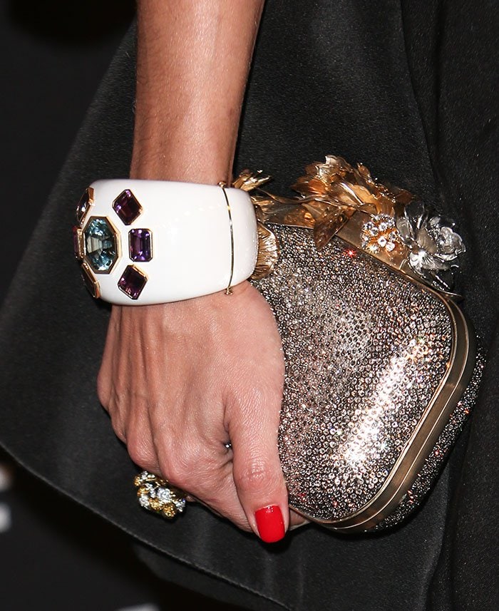 Olivia Palermo holds a sparkling Jimmy Choo clutch