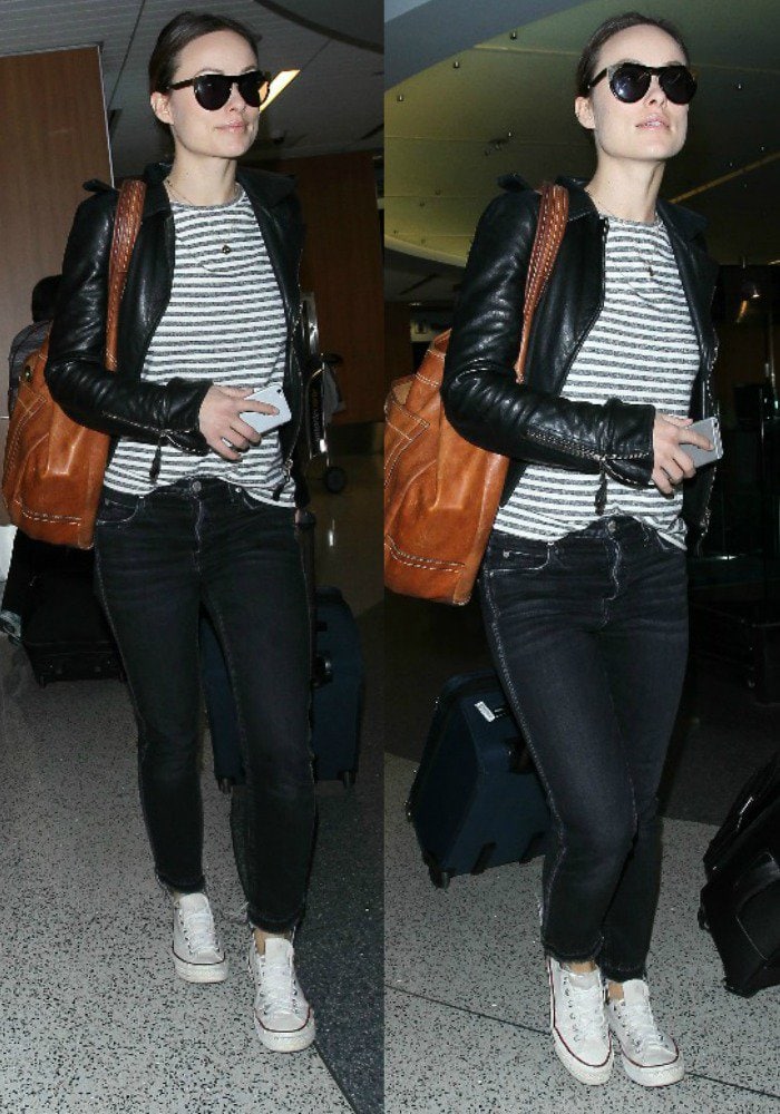 Olivia Wilde wears her hair back as she departs Los Angeles International Airport