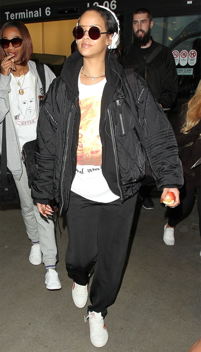 Rihanna looks cool and comfortable as she arrives at LAX in sweatpants and a white t-shirt