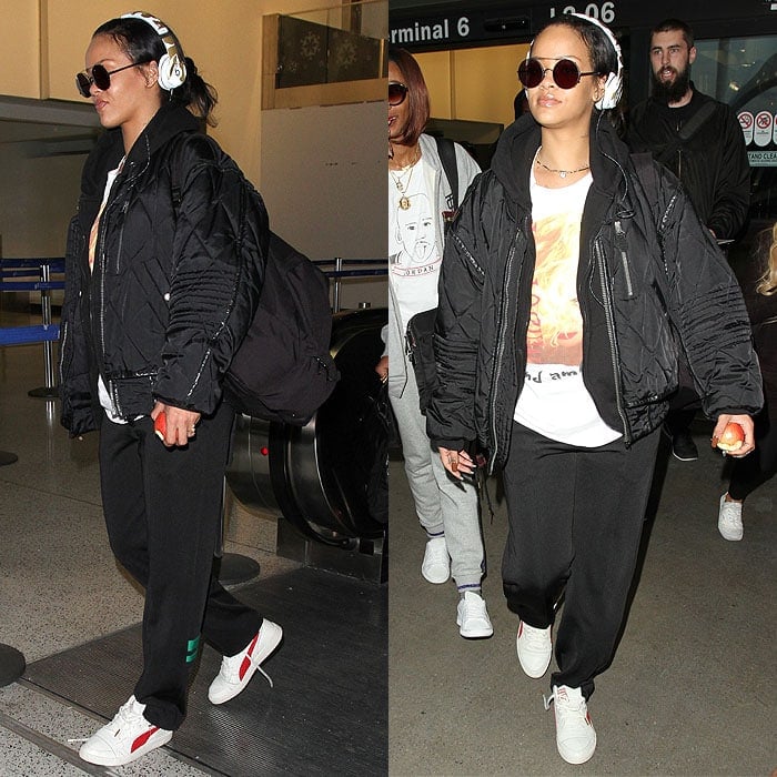 Rihanna wears white sneakers with a hoodie and sweatpants