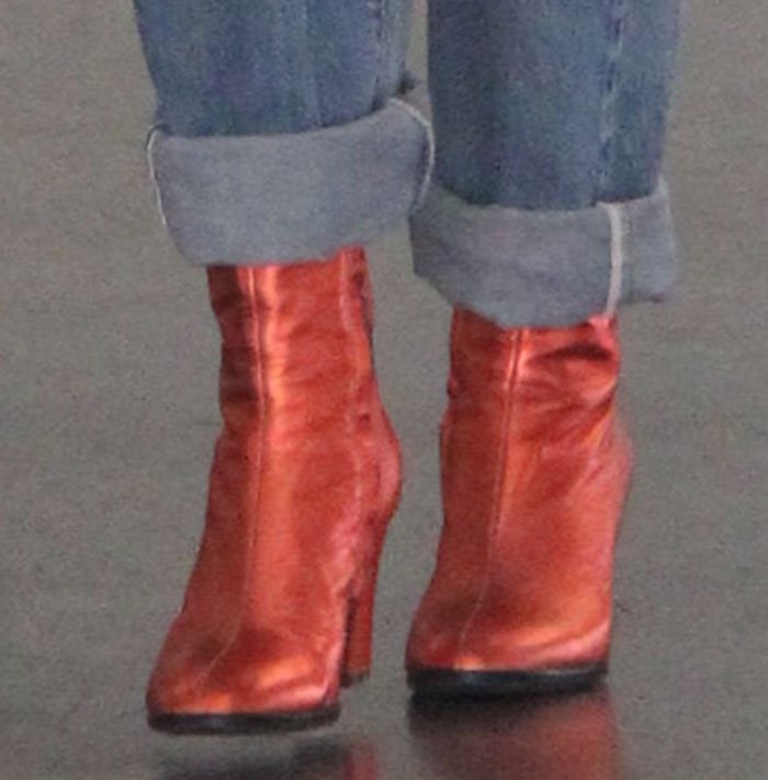 Rita Ora wears a pair of block-heeled red booties