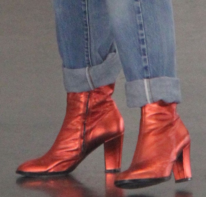 Rita Ora wears a pair of metallic red boots