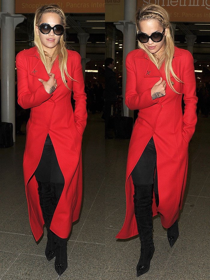 Rita Ora leaves her hair down during a stroll through King's Cross station