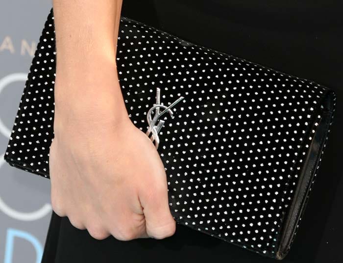 Rosie Huntington-Whiteley holds her Yves Saint Laurent clutch