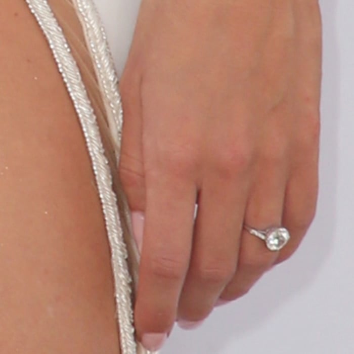 Rosie Huntington-Whiteley's rose gold engagement ring from Neil Lane features a 5-carat round diamond from the Edwardian era