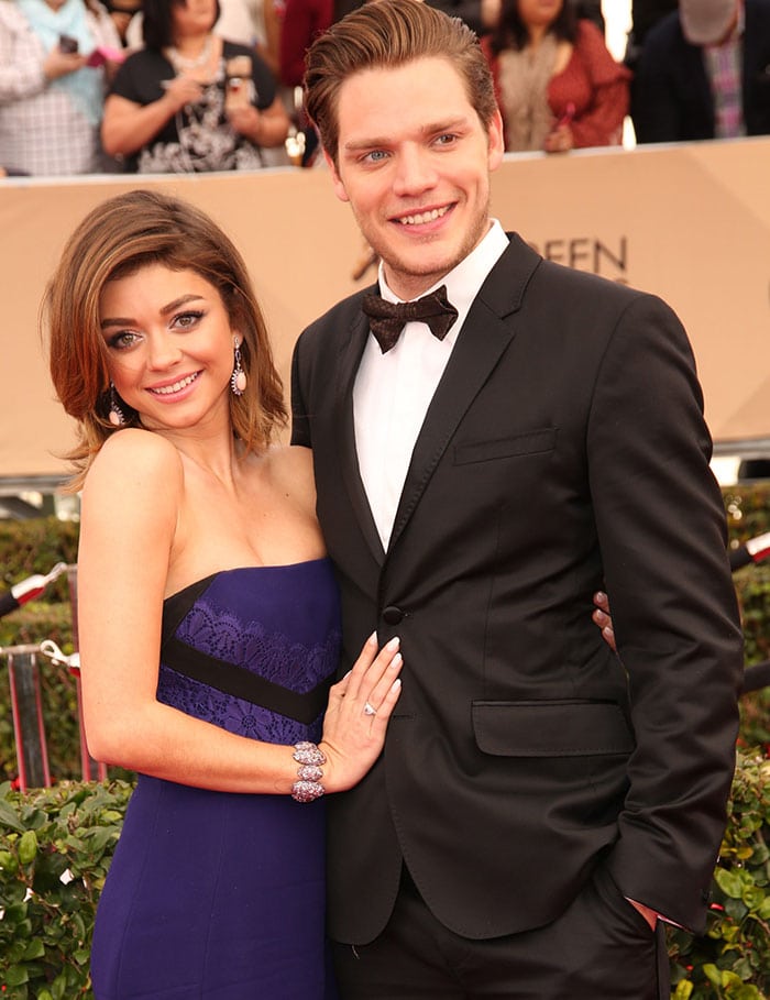 Sarah Hyland and boyfriend Dominic Sherwood pose for photos on the red carpet