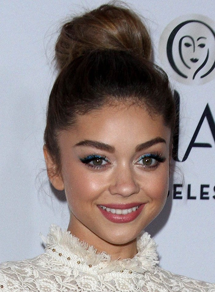 Sarah Hyland shows off the fringed detailing on the neck of her Zimmerman lace dress