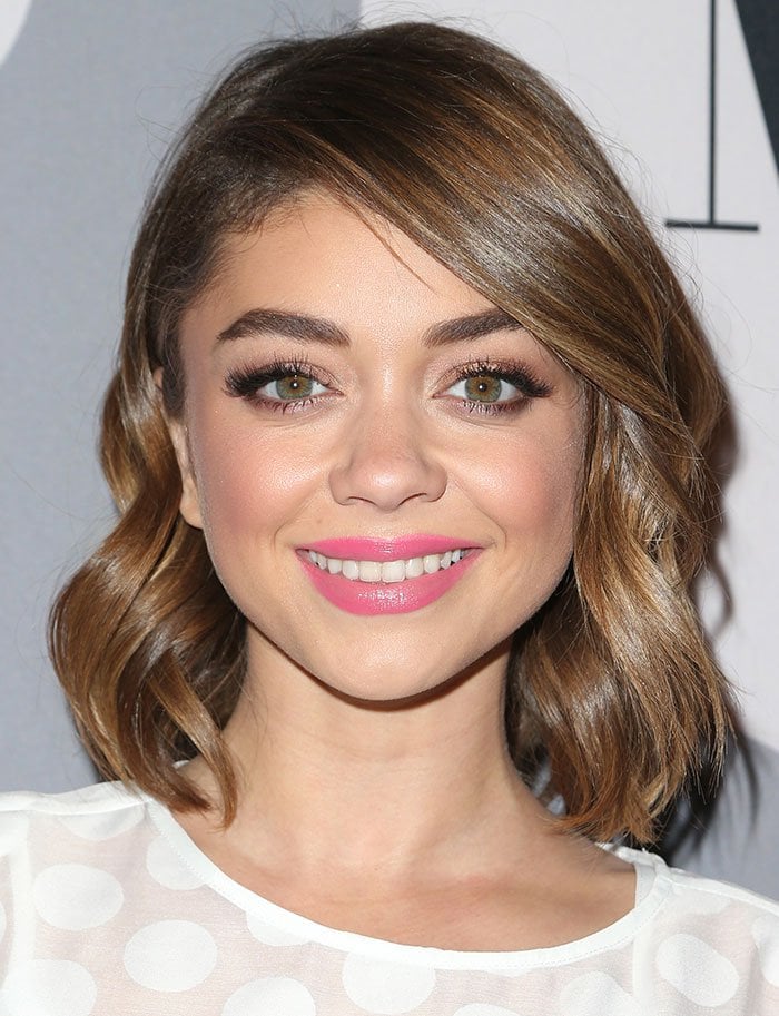 Sarah Hyland curls her hair for the Minnie Rocks The Dots Art And Fashion E...