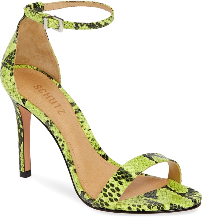 An elegant high-heel sandal features simple styling and a slim ankle strap