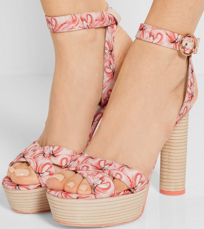 These printed satin platform sandals have a substantial wood platform to temper the towering circular heel