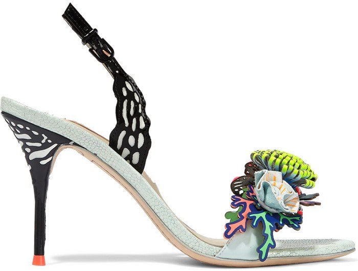This whimsical pair is appliquéd with laser-cut black patent-leather on the slingback straps and stiletto and has a subtly shimmering iridescent lizard-effect sole