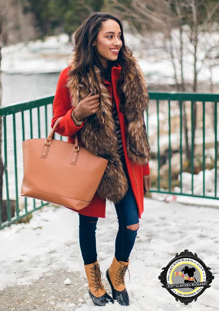 Elizabeth looked glamorous pairing a red coat with a fur scarf