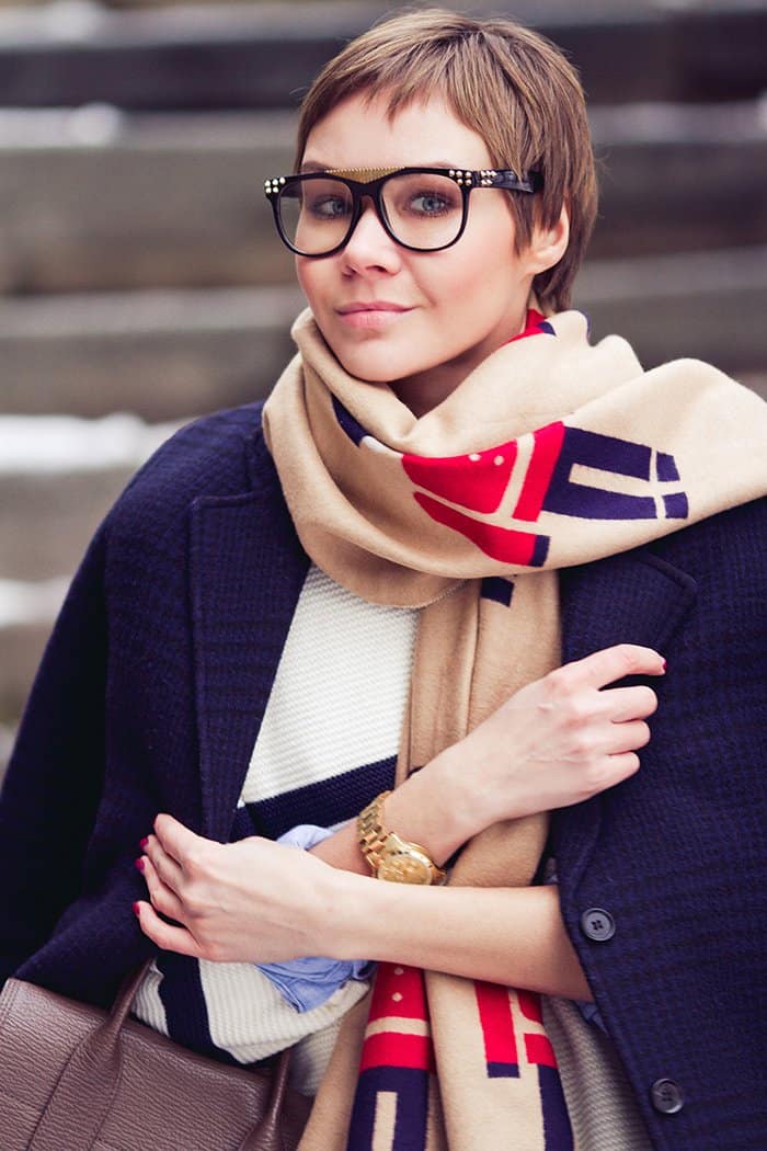 Lidia wears trendy glasses with her chic scarf