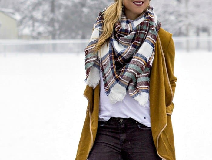 Rachel shows how to wear a plaid scarf in winter