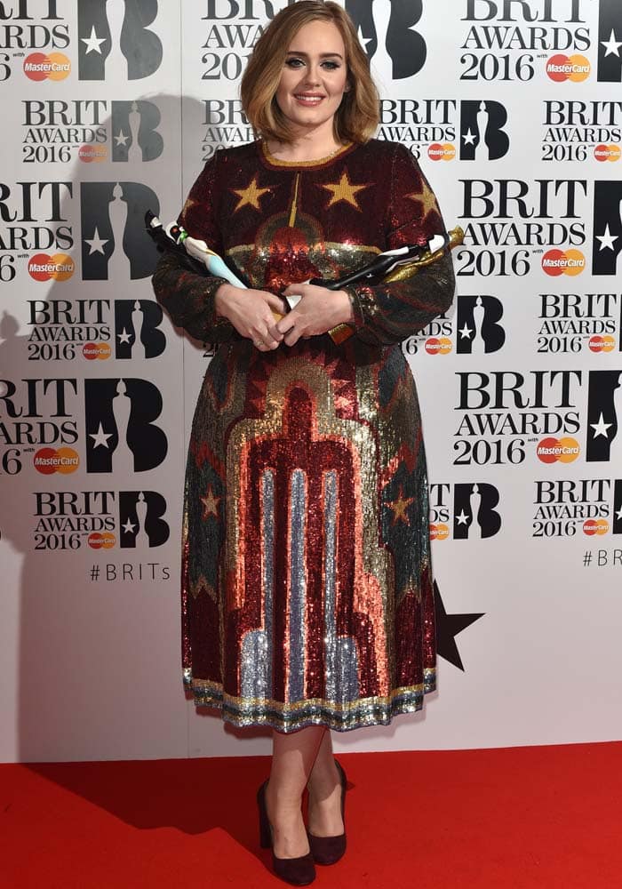 Adele wears a shimmering Valentino dress on the red carpet