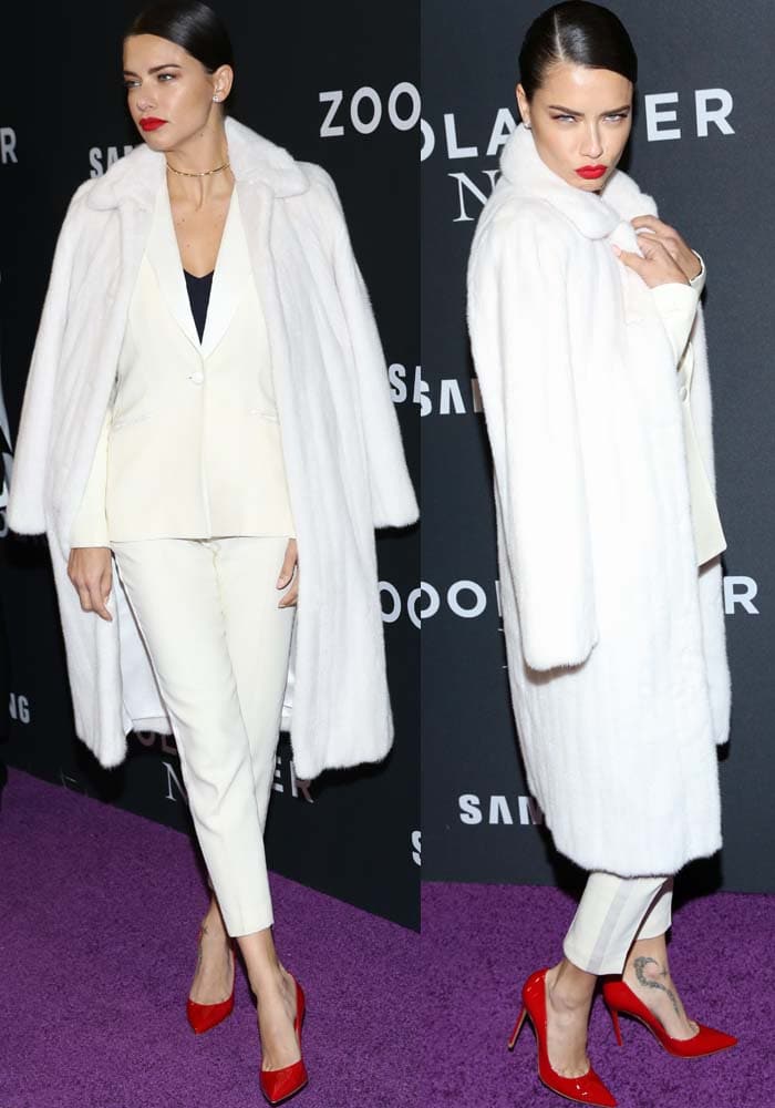 Adriana Lima wears a plush white coat from Pologeorgis and copies Zoolander's Blue Steel look