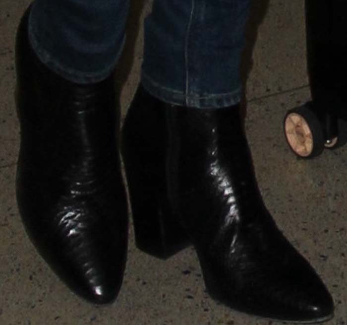 Alessandra Ambrosio's feet in crocodile-print Saint Laurent boots