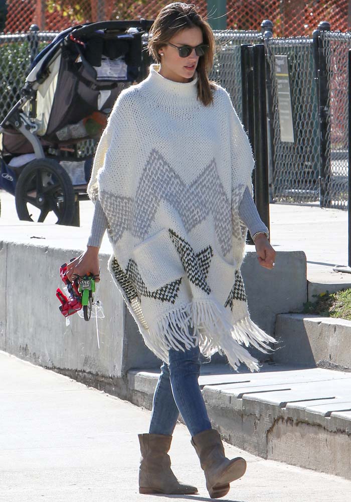 Alessandra Ambrosio styled her poncho with jeans and a gray knit sweater