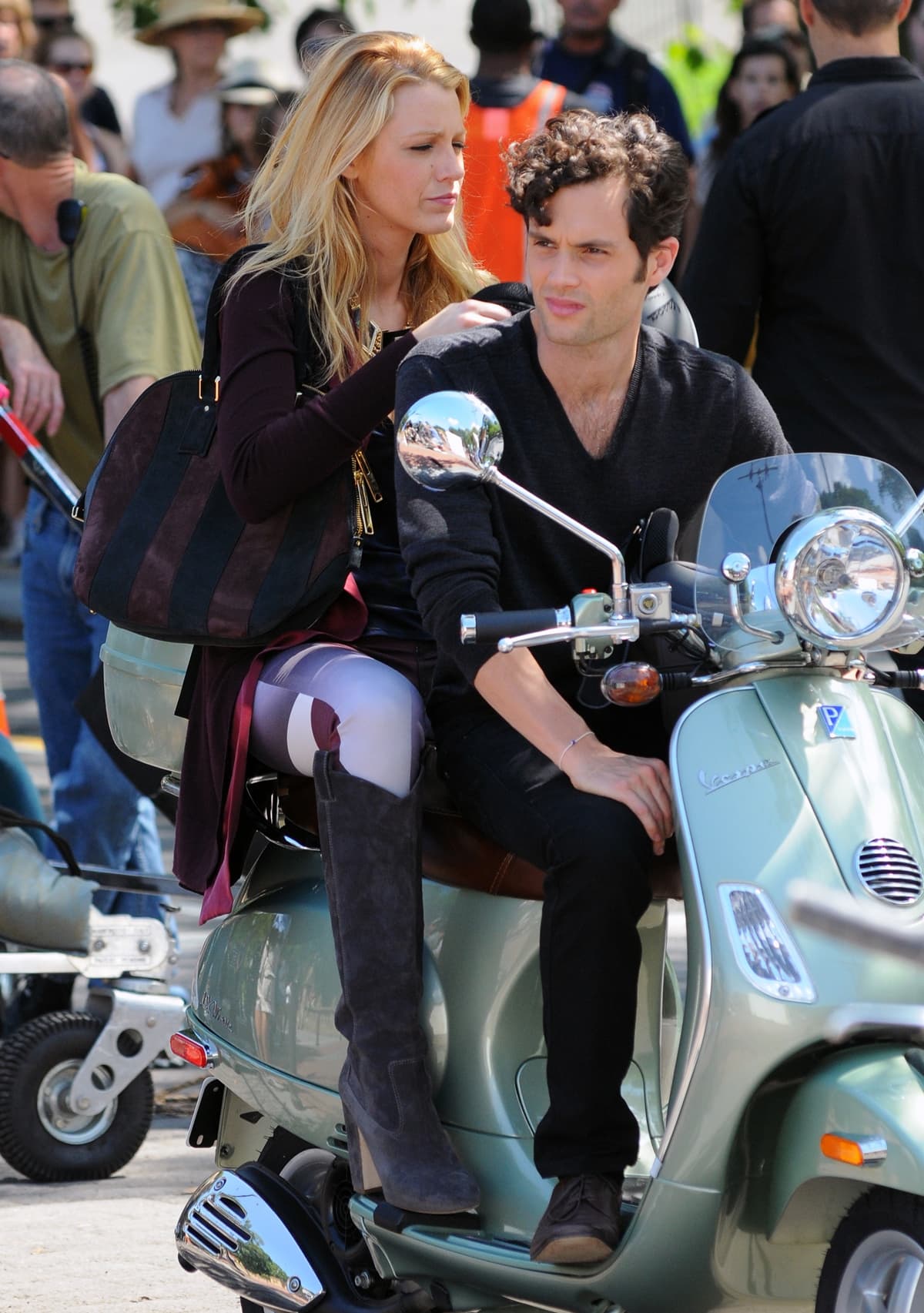 Blake Lively and Penn Badgley ride a Vespa scooter on the set of Gossip Girl in Central Park in New York City