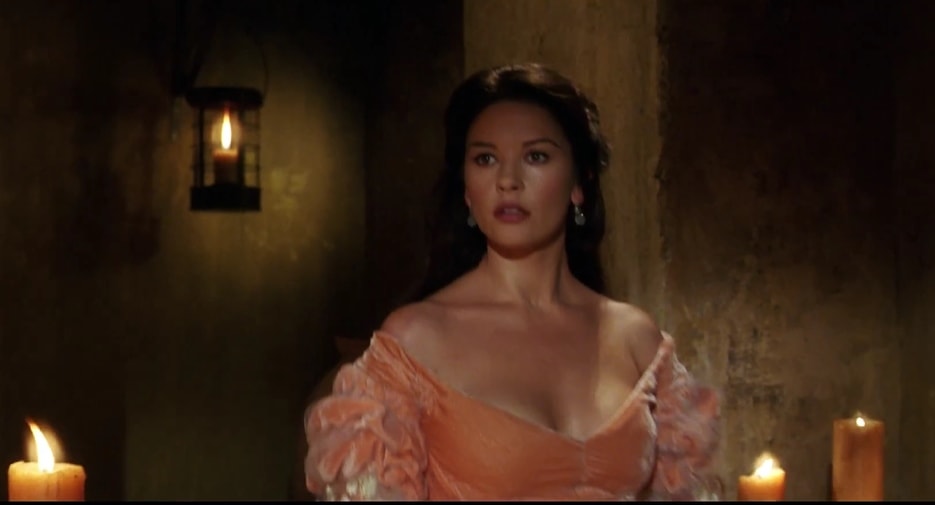 Catherine Zeta-Jones exuded timeless elegance and undeniable allure in her romantic off-the-shoulder gown in The Mask of Zorro