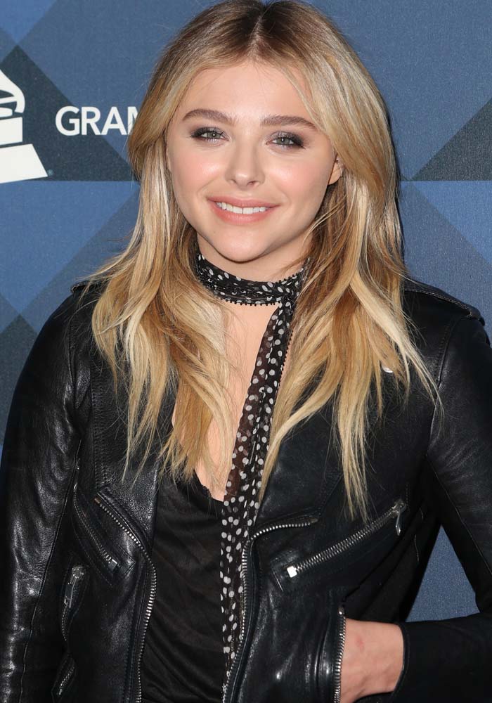 Chloë Grace Moretz wears a black Saint Laurent leather biker jacket named after The Perfecto, the first motorcycle-style jacket created in 1928 by Irving Schott