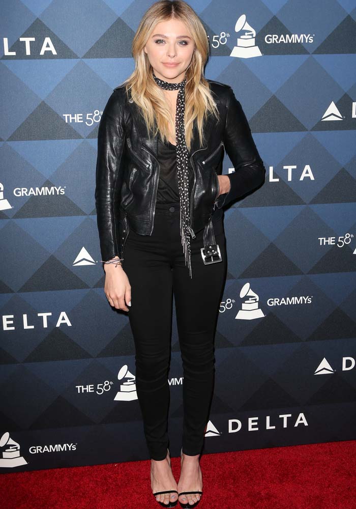 Chloe Moretz wears an all-black look with a leather jacket on the red carpet