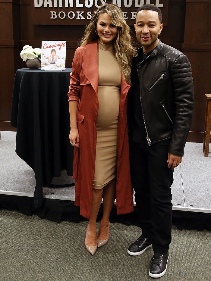 Chrissy Teigen and husband John Legend pose for photos at Chrissy's cookbook signing