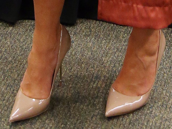 Chrissy Teigen's feet in nude leather Kurt Geiger pumps