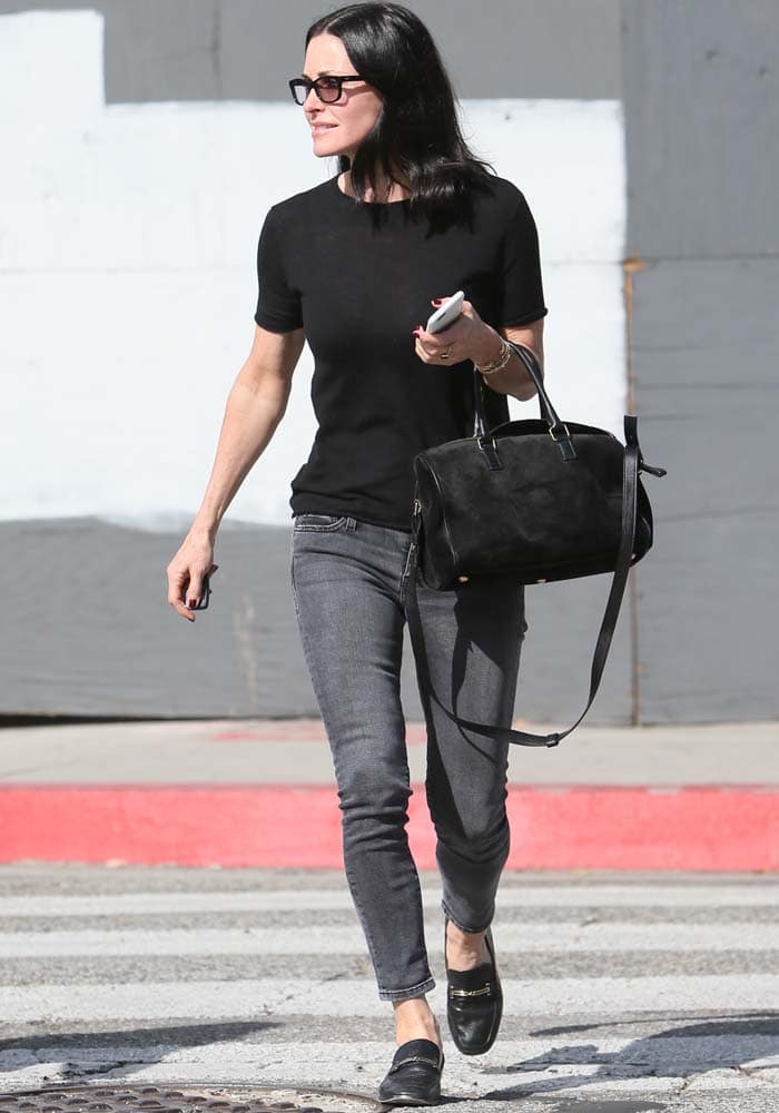 Courteney Cox goes casual in a black tee and gray jeans