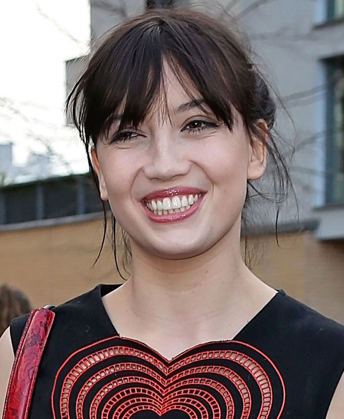 Daisy Lowe's dark tresses were pulled up into a messy but chic updo